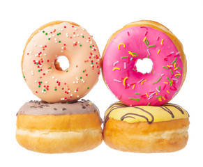 Delicious colorful donuts isolated on white background