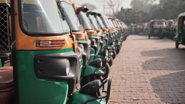 Indian taxi rickshaws exposed in a row.