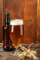 Glass beer on wood background