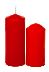 A selection of red candles on a white background