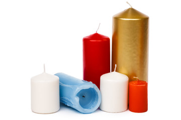 Many colorful candles isolated on white background