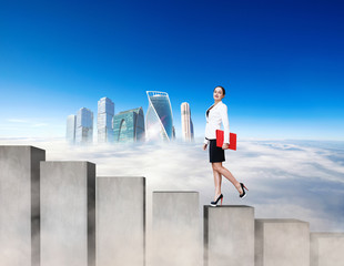 Business woman climbing the concrete stairs blocks.