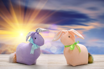 Two Easter bunnies and empty space for text. Easter holiday concept.