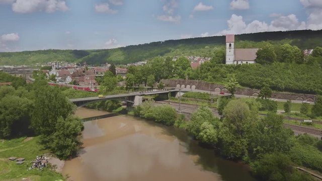 Germany - Drone flight over river Neckar and city Plochingen with church