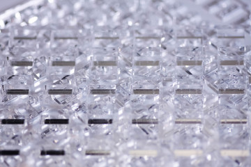 Abstract high-tech geometrical background. Details of transparent plastic or glass. Laser cutting of plexiglass or 3d printing.
