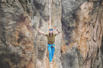 Man balancing on the rope concept of risk taking and challenge.