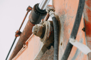 Details of the broken mechanism and peeling paint. The texture of old rusty metal and rubber.