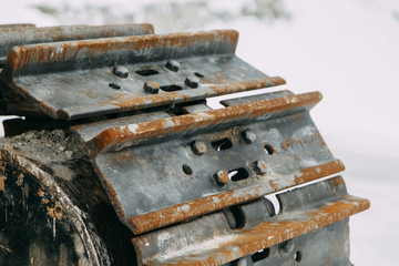 Details of the broken mechanism and peeling paint. The texture of old rusty metal and rubber.