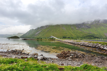 Beautiful scandinavian landscape with Atlantic Ocean Road (Atlanterhavsvegen), meadows, mountains and fjords. Lofoten islands, Norway.