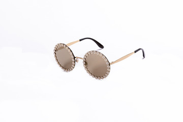 Sunglasses with brown glasses on an isolated white background