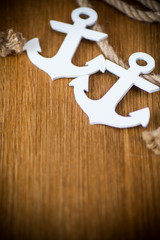 white decorative anchor on a wooden background