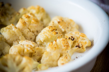 baked cauliflower with spices in ceramic form