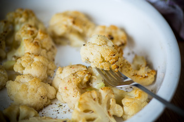 baked cauliflower with spices in ceramic form