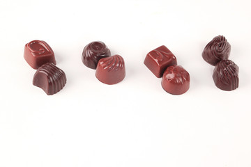 few chocolates isolated on white.photo with copy space