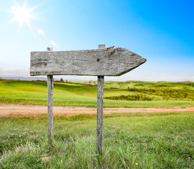Spring background of wooden desk and Tuscany landscape 