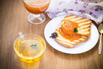 Fototapeta na wymiar fried toast with apricot jam in a plate