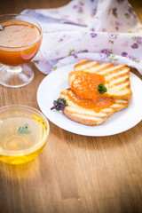 fried toast with apricot jam in a plate