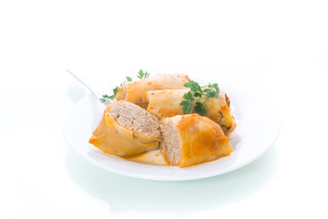 Stuffed cabbage leaves with minced meat and rice in tomato sauce.