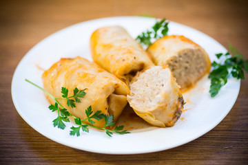 Stuffed cabbage leaves with minced meat and rice in tomato sauce.