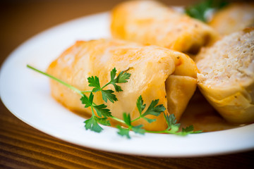 Stuffed cabbage leaves with minced meat and rice in tomato sauce.