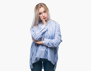 Young blonde woman over isolated background thinking looking tired and bored with depression problems with crossed arms.