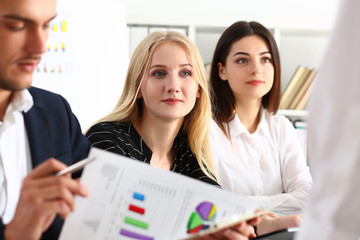 Group of people sit in office deliberate on problem