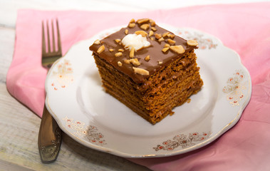 Fresh chocolate creamy cake with nuts