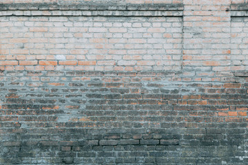 Texture of old masonry walls in Georgia. Sunlight and shadows from the leaves on the bricks.