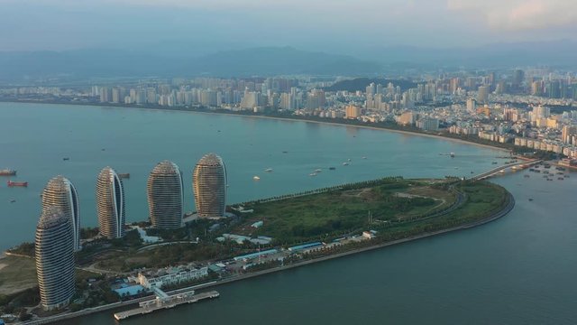 sunset sanya city famous hotel resort island bay aerial panorama 4k hainan china