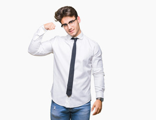 Young business man wearing glasses over isolated background Strong person showing arm muscle, confident and proud of power
