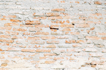 Texture of old masonry walls in Georgia. Sunlight and shadows from the leaves on the bricks.