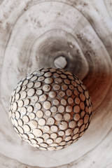 Art an object from a tree in the form of a sphere. Macro photo background. Soft focus.