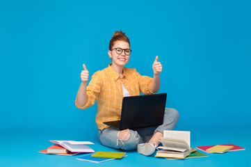 education, high school, technology and people concept - red haired teenage student girl in...