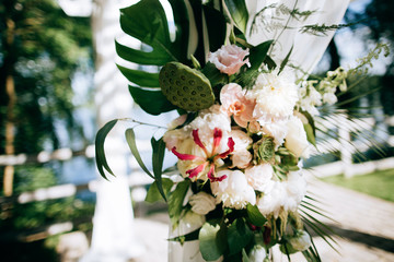 bouquet of beautiful white flowers on the wedding arch
