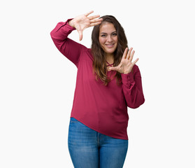 Beautiful plus size young woman over isolated background Smiling doing frame using hands palms and fingers, camera perspective