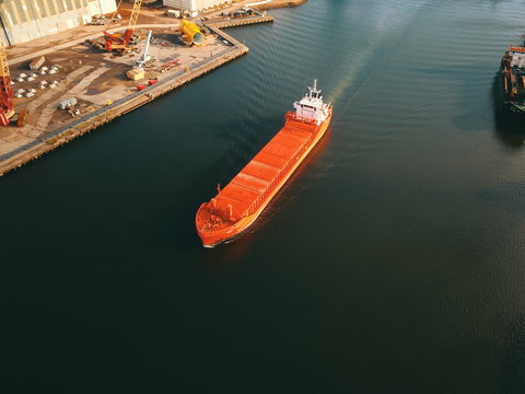 The river tees at Middlesbrough showing a large ship passing down the tees near the iconic transporter bridge
