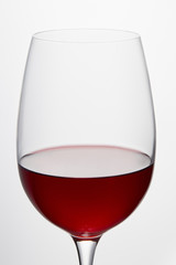 Wine glass with red wine isolated on white