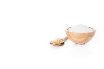 White rice flour in a bowl isolated on white background. Copyspace