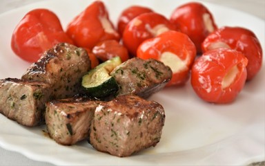 slices of roasted meat with zucchini and mini paprika with fresh cheese