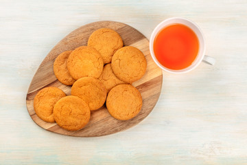 Gingersnaps, shot from above with a cup of tea and a place for text