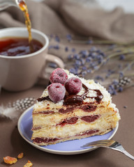 Delicious summer cherry cake on a purple plate