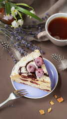 Delicious summer cherry cake on a purple plate