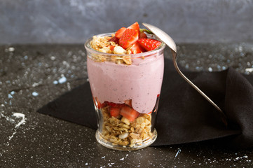 Homemade natural yogurt with strawberries and muesli.