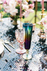 Elegant black and pink table setting for wedding reception with bouquets