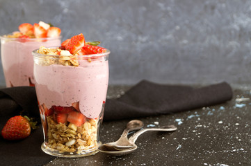 Homemade natural yogurt with strawberries and muesli.