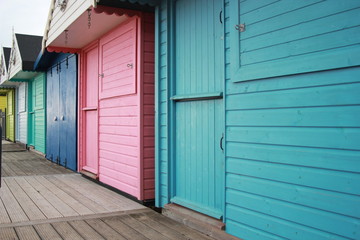 Obraz na płótnie Canvas Beach huts at Walton on the Naze, Beach Huts, Essex, England, beach huts are traditional seaside feature for people to change or base themselves. Walton-on-naze, Essex, UK