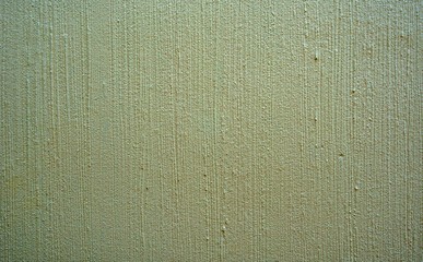 A white rough concrete wall background texture. A vertical stripe white concrete wall background texture.