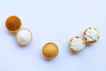 Various types of sugar on white.