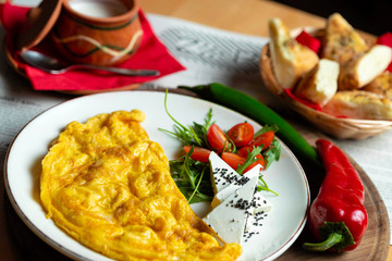 Classic egg omelette served with cherry tomat