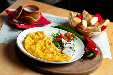 Classic egg omelette served with cherry tomat